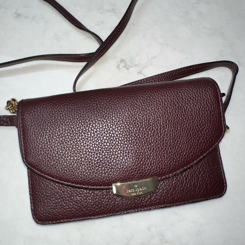 Kate Spade dark maroon thin crossbody never used. Great condition